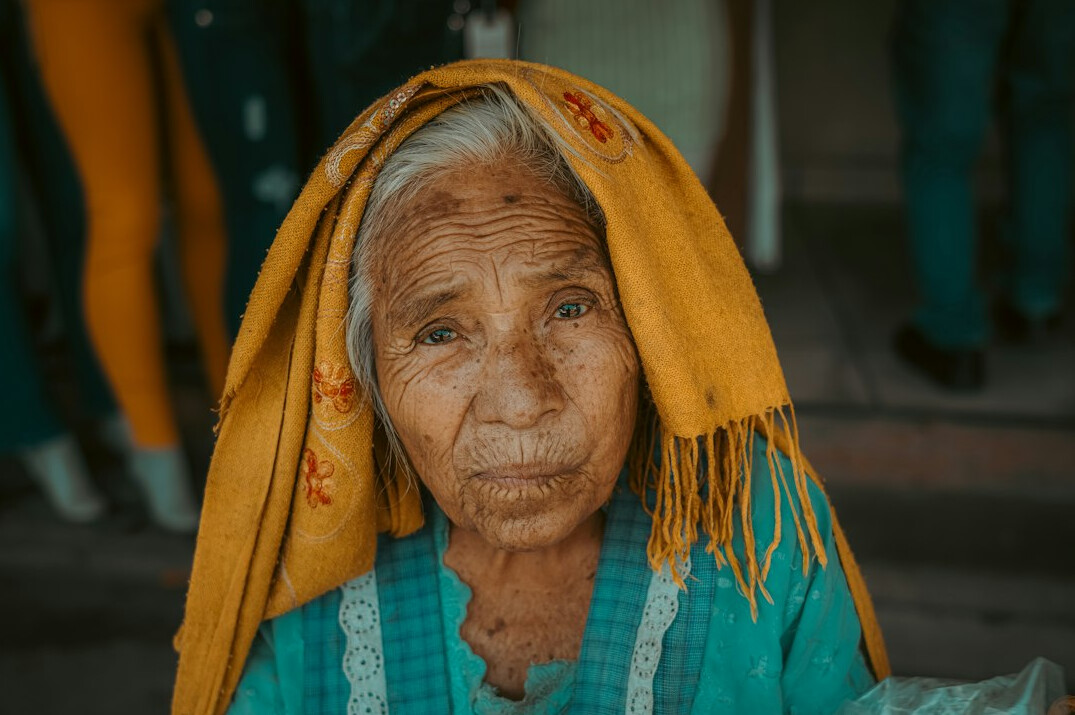 Portrait of a mature Mexican woman with gray hair and a kind smile