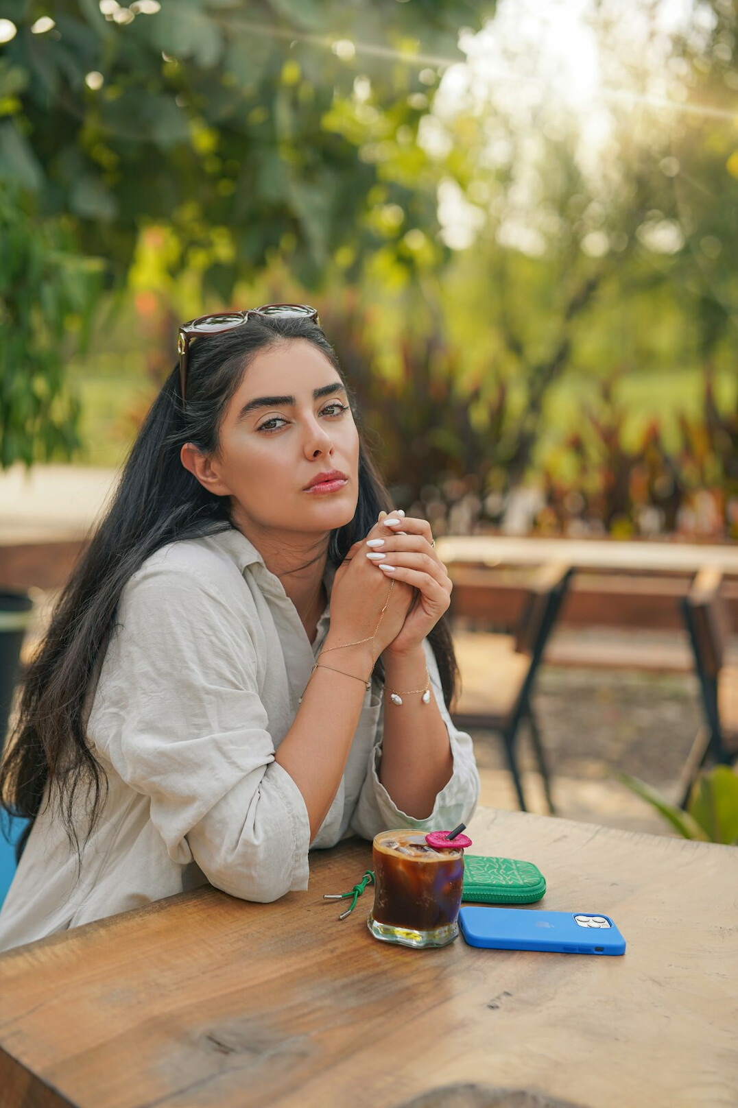 Mexican woman listening attentively to a friend in a cafe