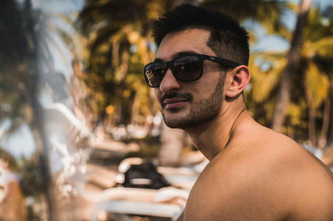 Portrait of a smiling Mexican man with short dark hair