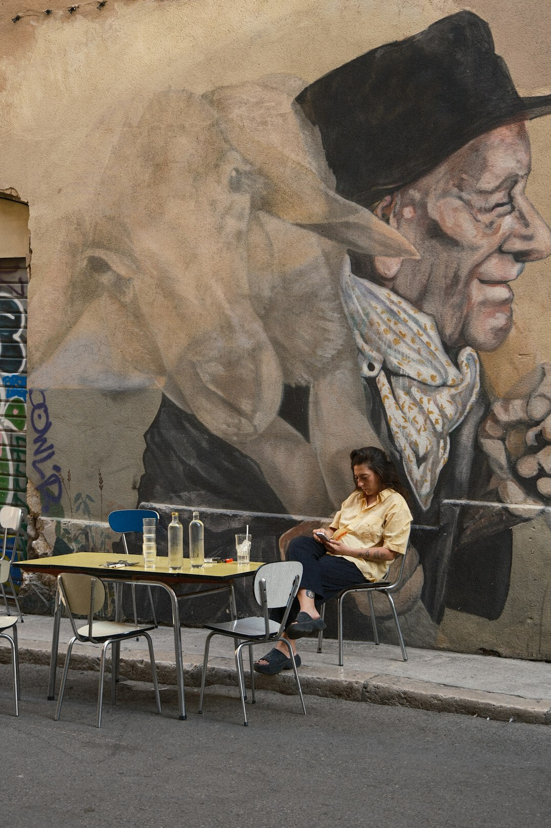 Mexican woman writing in a planner at a cafe table