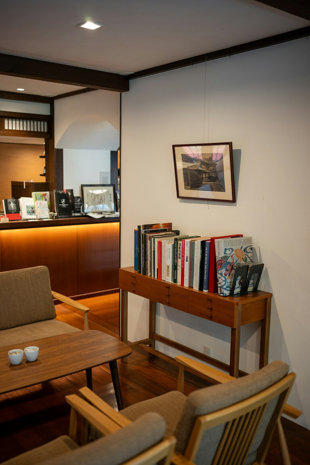 Cozy reading corner with an armchair and a stack of books