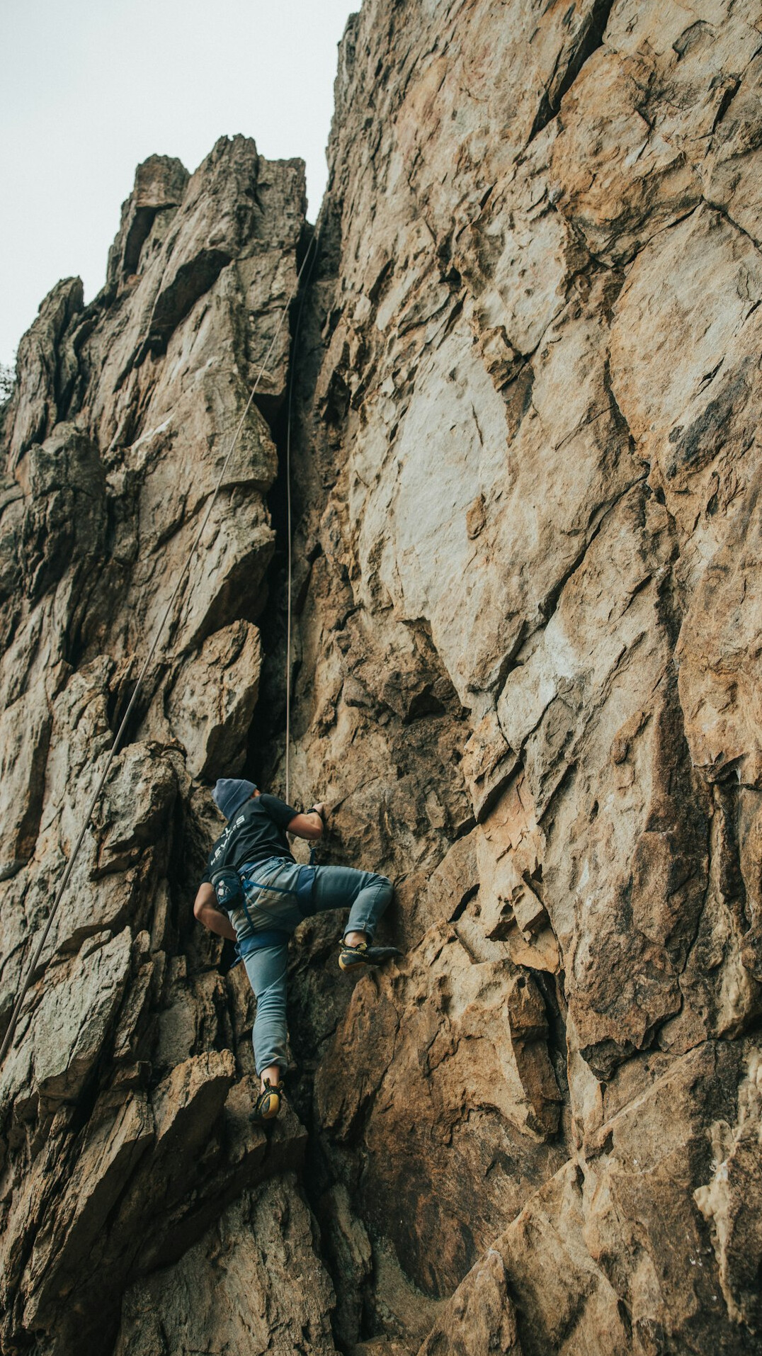 person climbing mountain