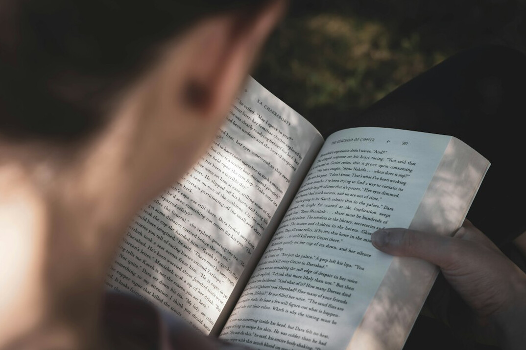 person reading self help book